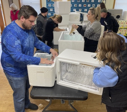 Volunteers making cat shelters
